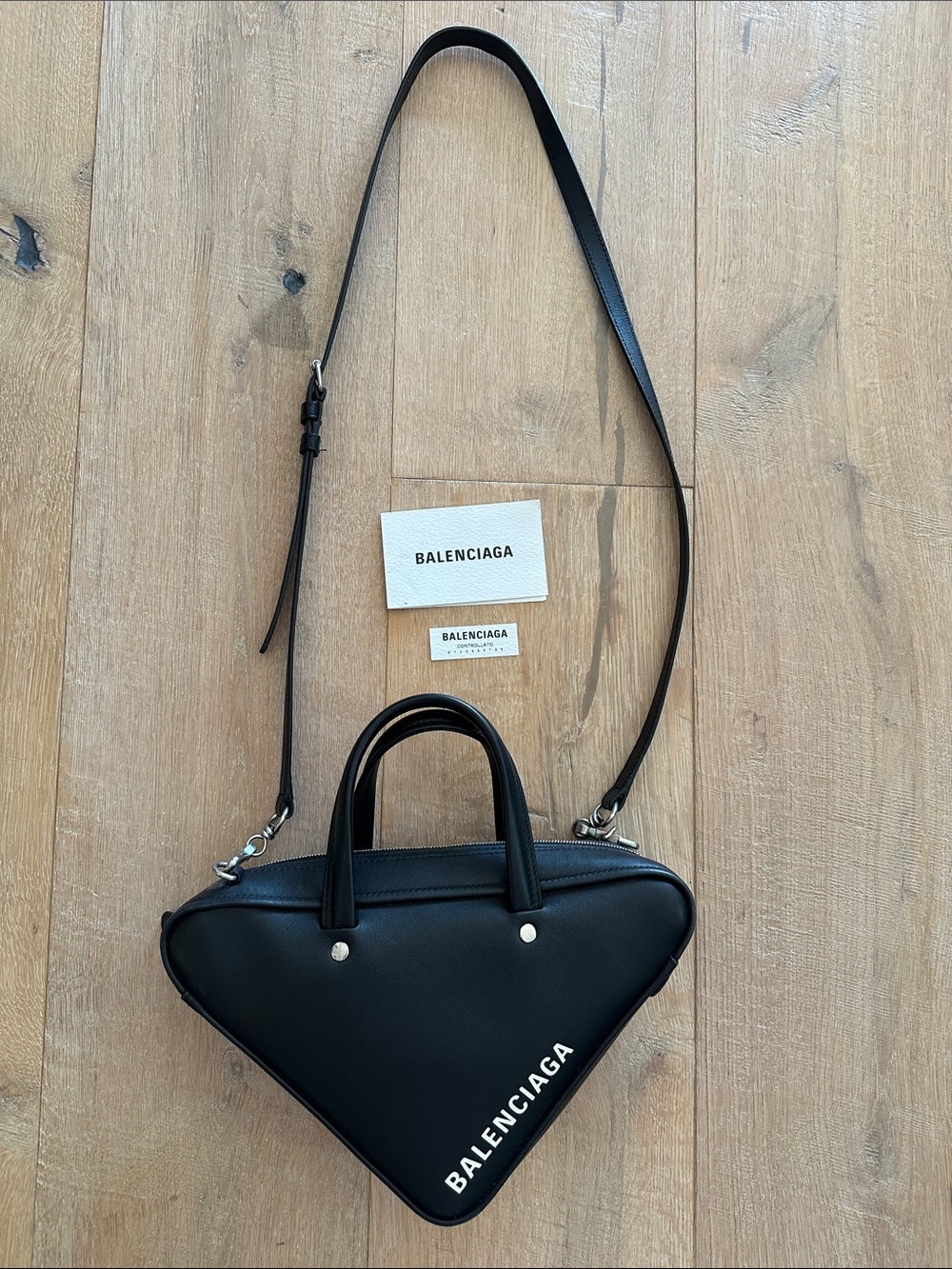 AUTHENTIC Balenciaga Black Triangle Leather Crossbody with White Logo Accent